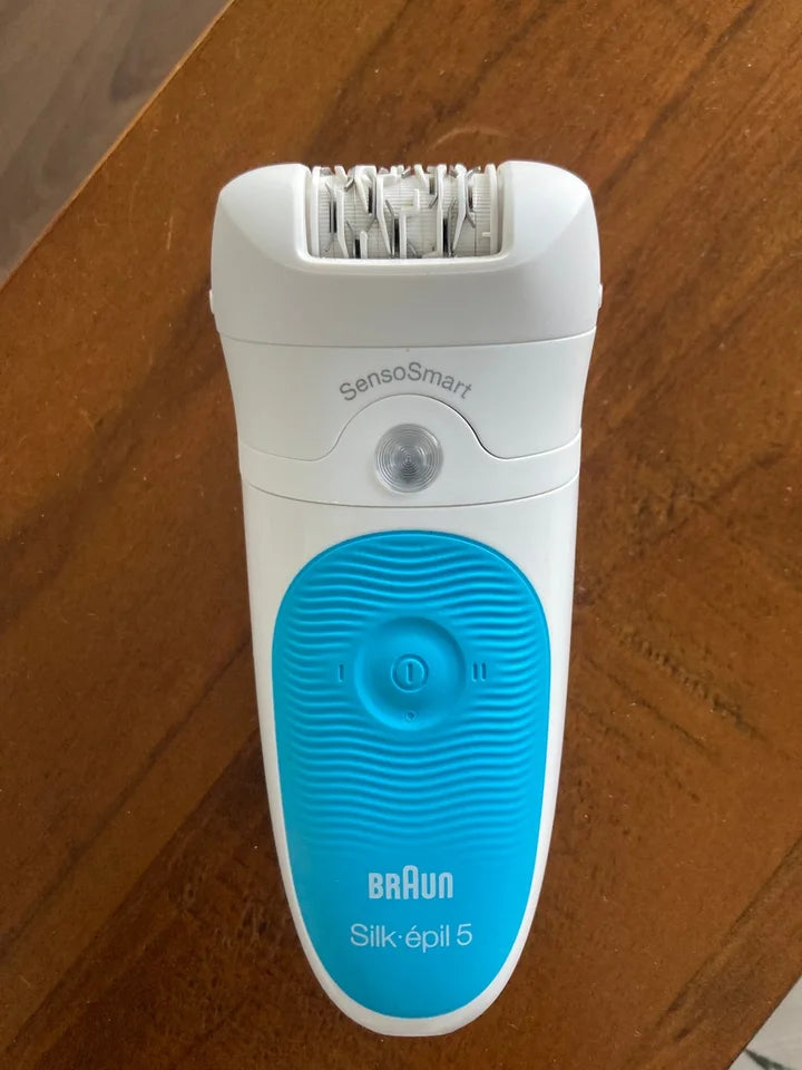 Braun Silk epil 5 epilator on a wooden surface