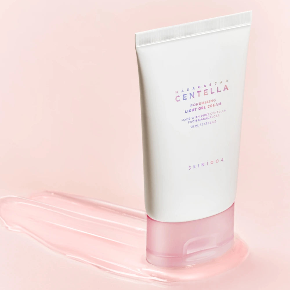 Skincare tube labeled 'Hanskin Centella' on a pink background