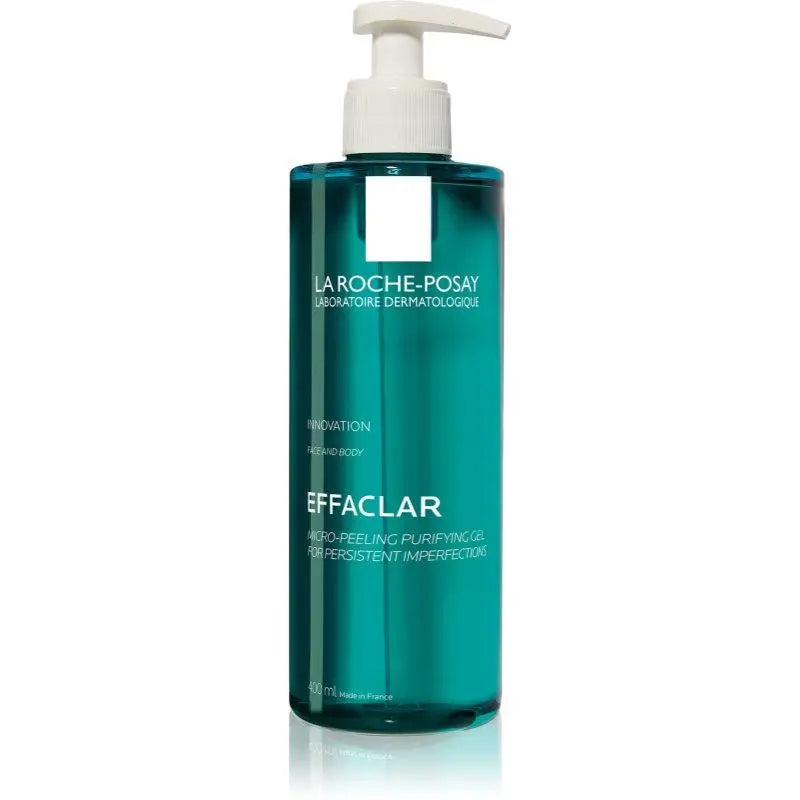 A 500ml bottle of La Roche-Posay Effaclar Micropeeling Purifying Emulsion, featuring a translucent teal-green bottle and a white pump dispenser, set against a plain white background.
