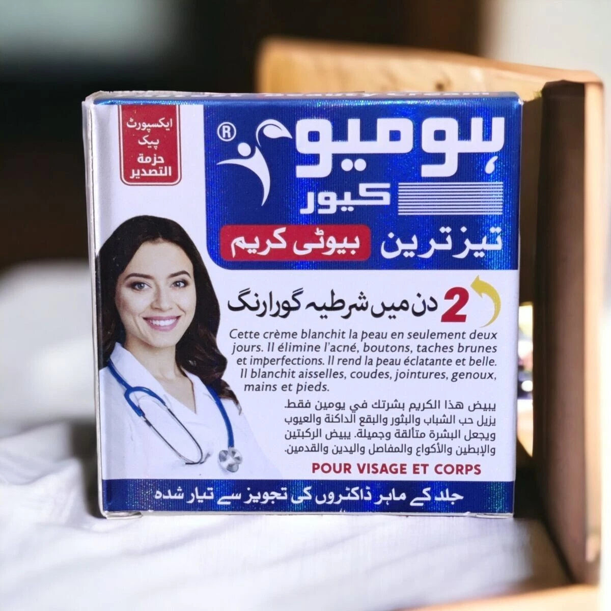Homeo Cure Beauty Cream packaging with a doctor's image on a white surface