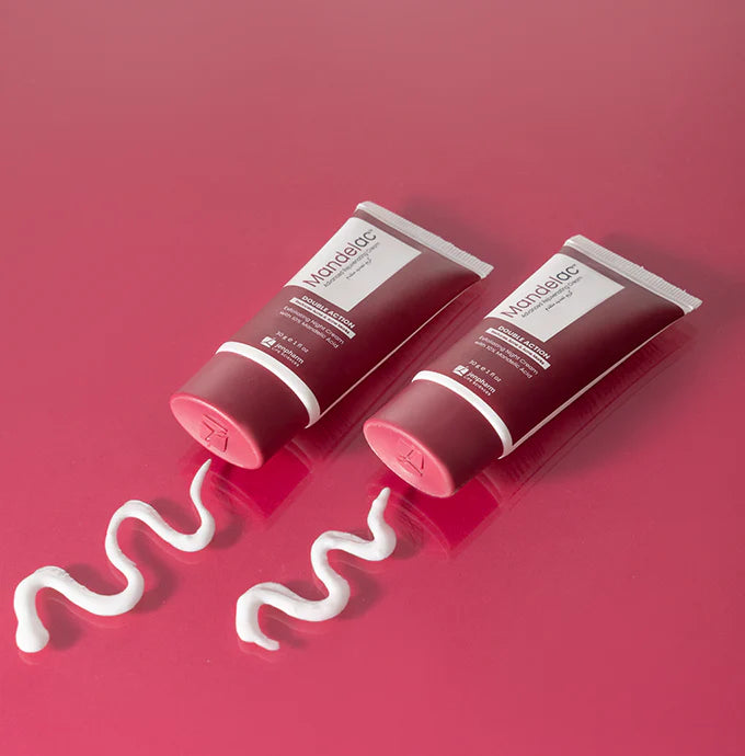 Two red tubes of Nanshine cream with white cream oozing out on a red background