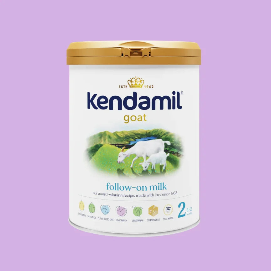 Kendamil goat milk powder container on a purple background