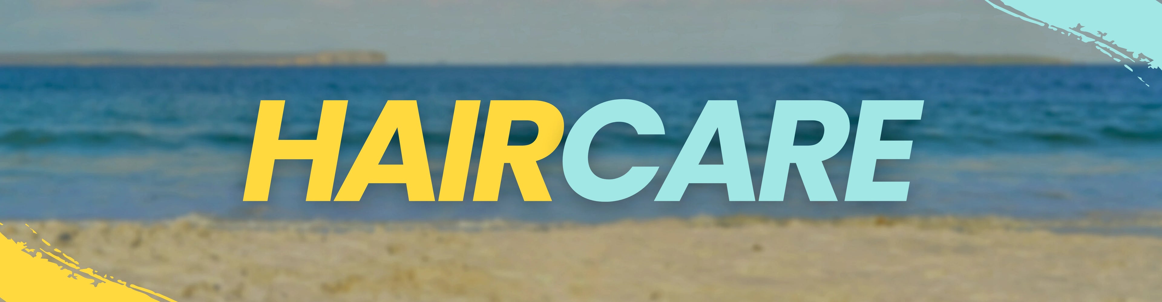 Text 'HAIRCARE' over a blurred beach background