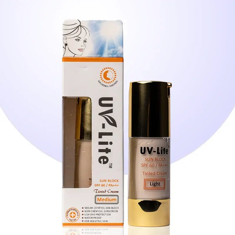 UV-Lite tinted cream sunscreen in a light shade, shown with its retail box and the cream bottle. The packaging features a white and orange design with a window displaying the beige-tinted cream inside.