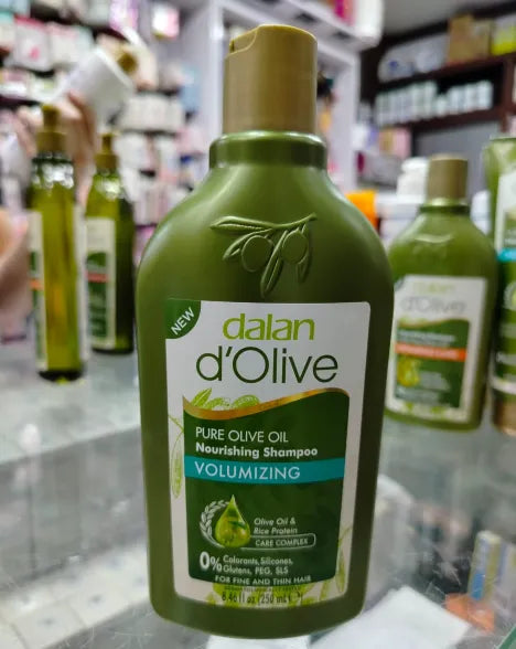 Green shampoo bottle labeled 'd'Olive' in a store setting
