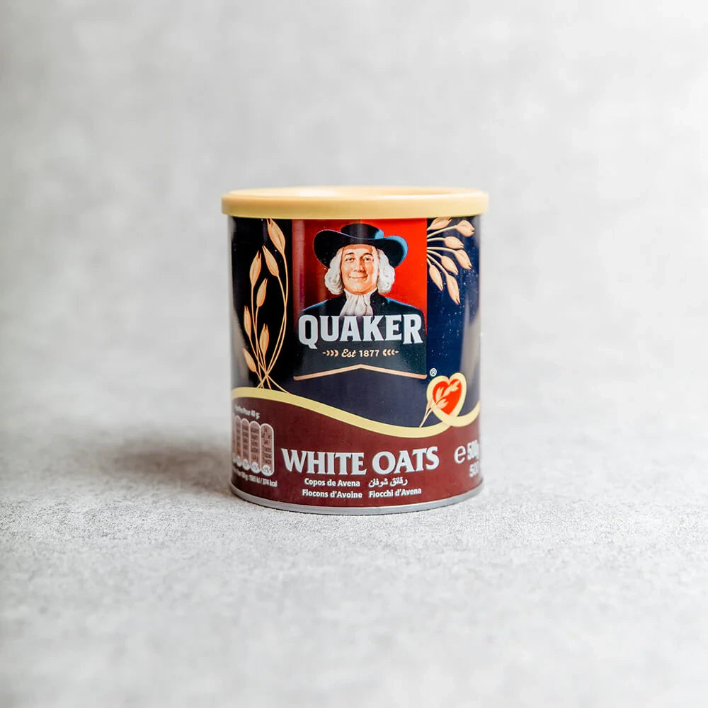 Quaker white oats container on a light gray background